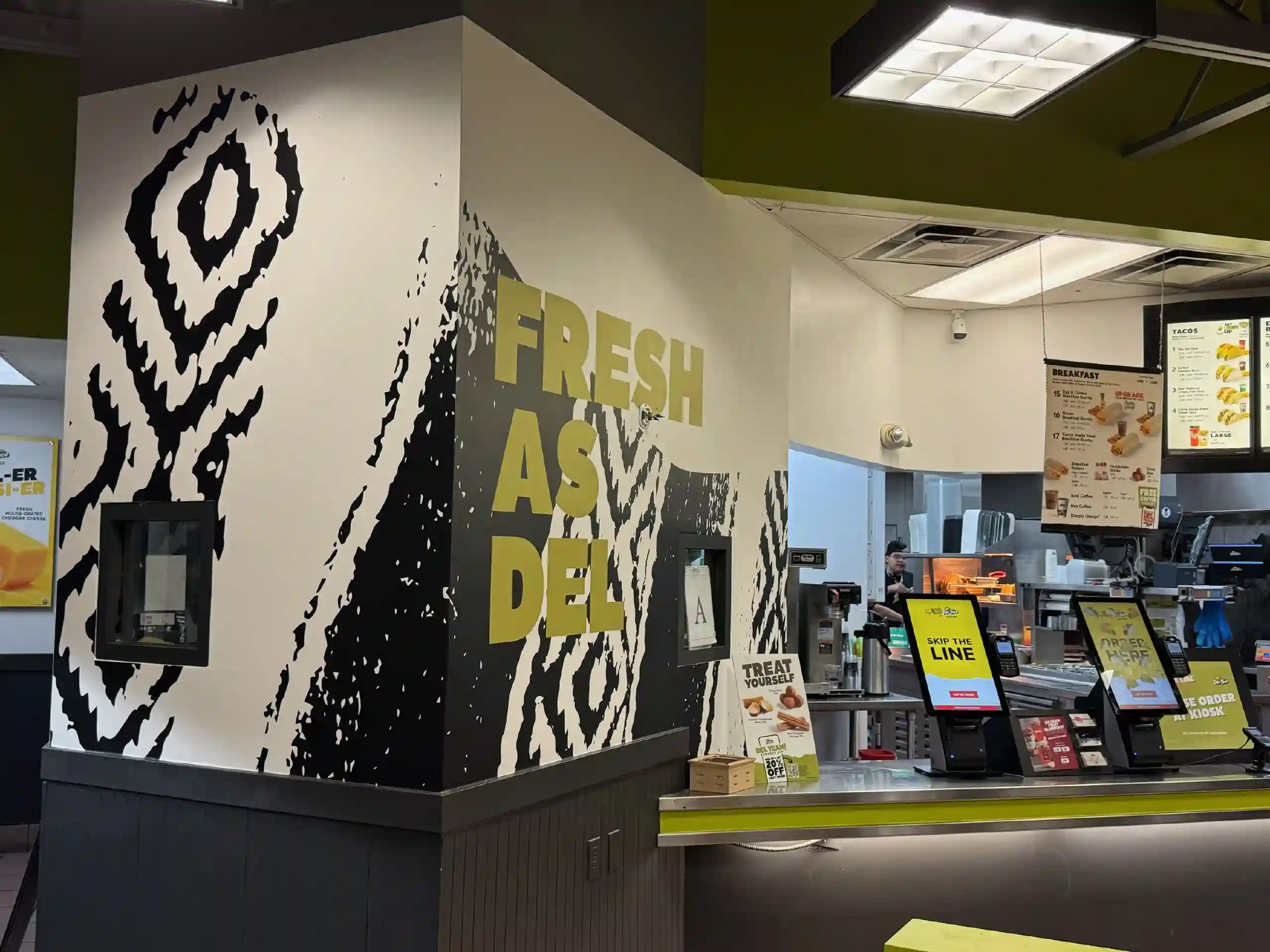 A boldly patterned wallcovering in a retail-style interior
